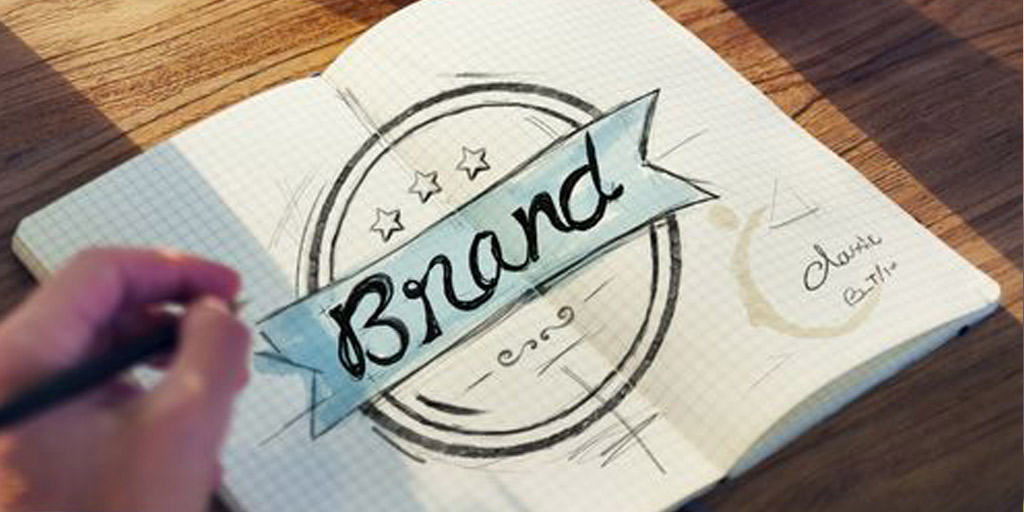 The word "brand" written in a notebook