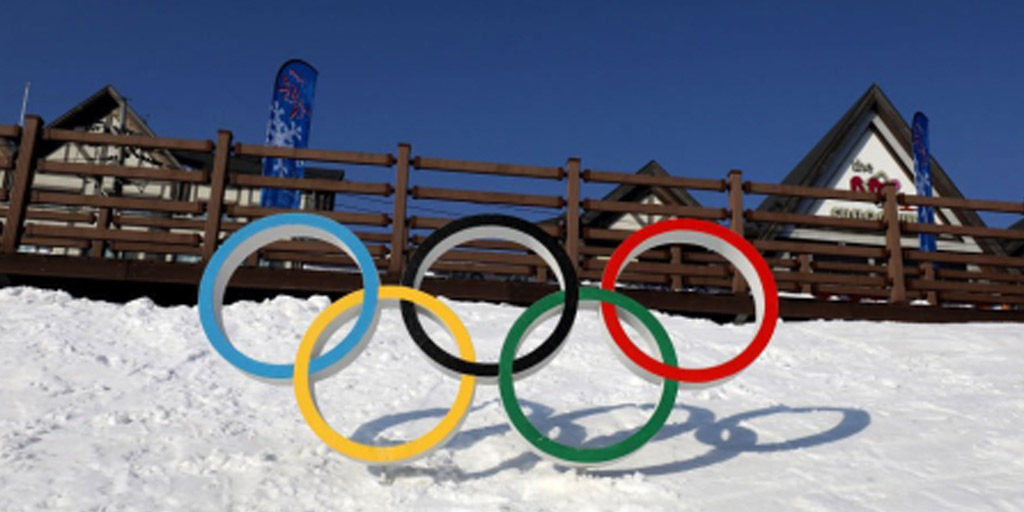 Olympic rings on top of snow