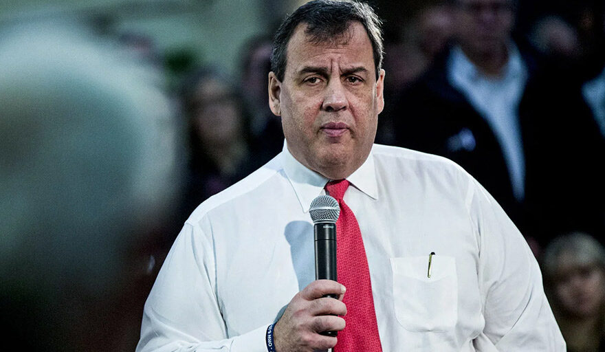 Chris Christie holding a microphone