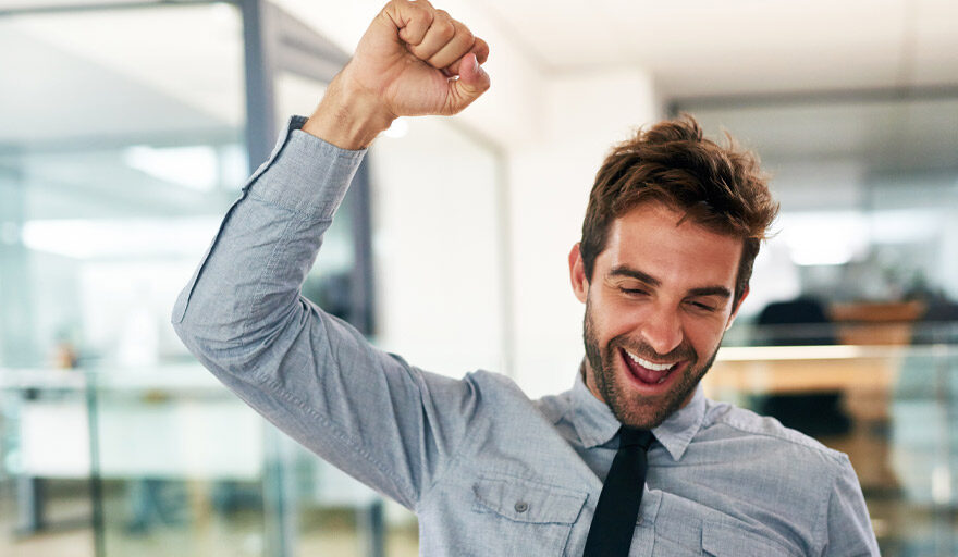 Man excited with fist in the air