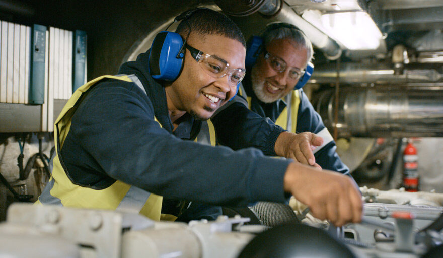 Two men working as machinists.