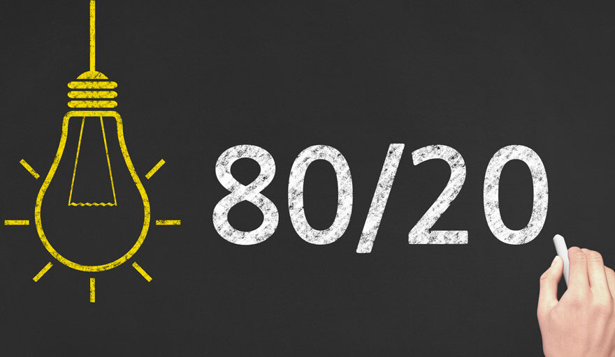Image of a black board with 80/20 written in chalk.